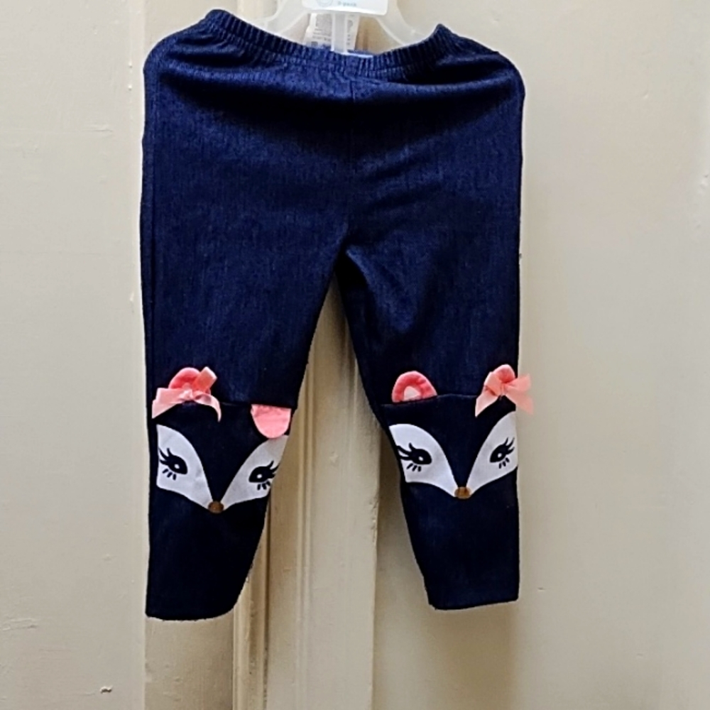 Size 2T denim blue jeans with squirrely girly face printed at knee